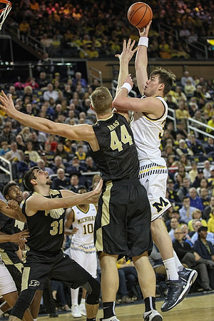 Derrick Walton Jr. (10) and Ricky Doyle (32)