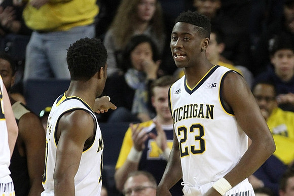 Derrick Walton Jr. (10) and Caris LeVert (23)