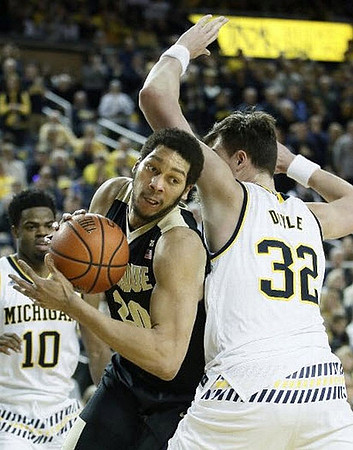 Derrick Walton Jr. (10) and Ricky Doyle (32)
