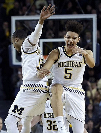 Muhammad-Ali Abdur-Rahkman (12) and D.J. Wilson (5)