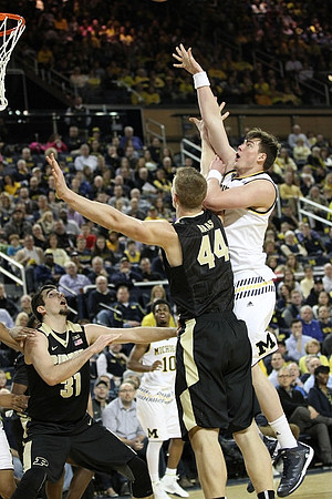 Derrick Walton Jr. (10) and Ricky Doyle (32)