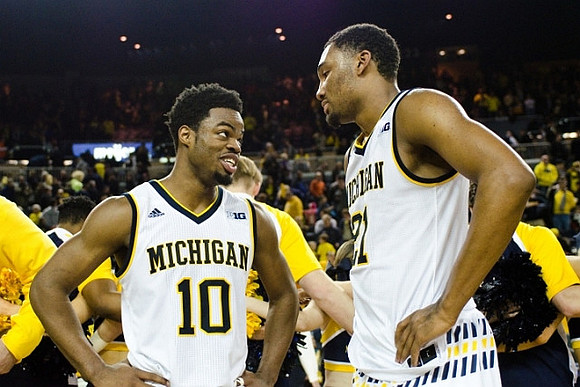Derrick Walton Jr. (10) and Zak Irvin (21)
