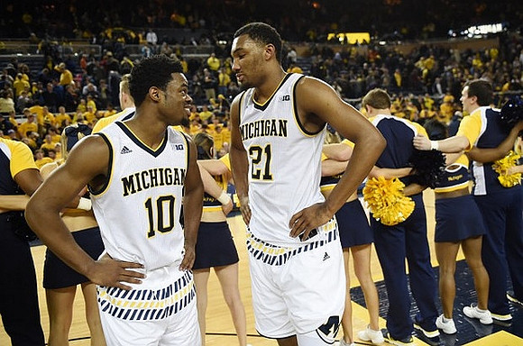 Derrick Walton Jr. (10) and Zak Irvin (21)