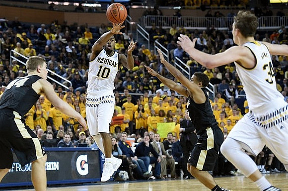 Derrick Walton Jr. (10) and Mark Donnal (34)
