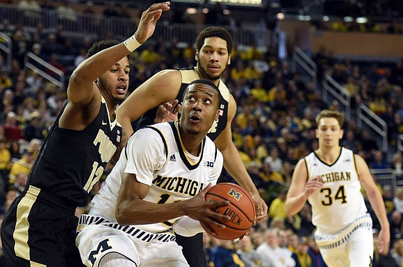 Muhammad-Ali Abdur-Rahkman (12) and Mark Donnal (34)