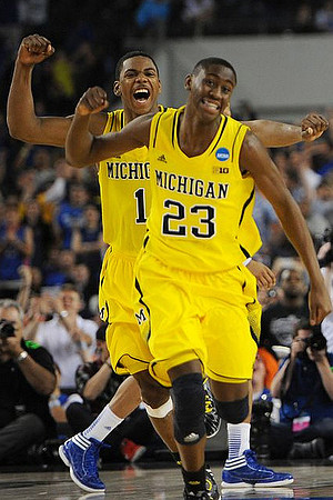 Glenn Robinson III (1) and Caris LeVert (23)