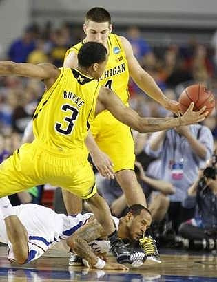 Trey Burke (3) and Mitch McGary (4)