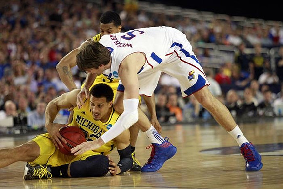 Jordan Morgan (52) and Trey Burke (3)