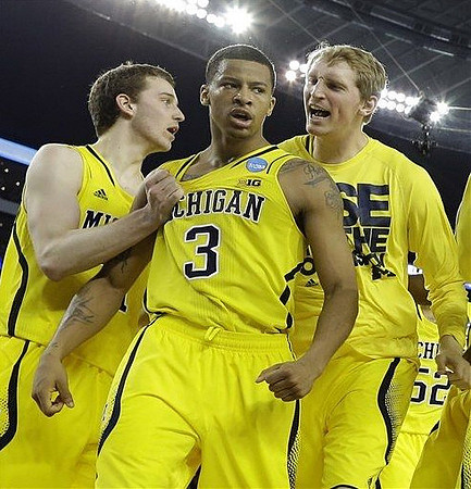 Nik Stauskas (11), Trey Burke (3), and Blake McLimans (22)