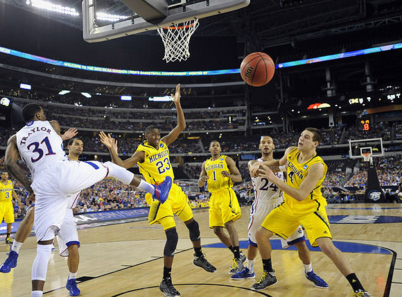 Trey Burke (3), Caris LeVert (23), Glenn Robinson III (1), and Mitch McGary (4)