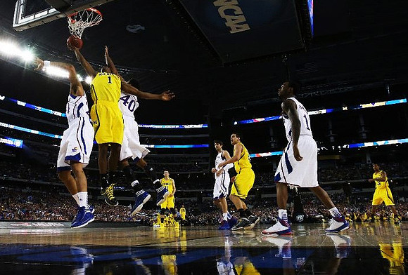 Glenn Robinson III (1), Nik Stauskas (11), Mitch McGary (4), and Trey Burke (3)