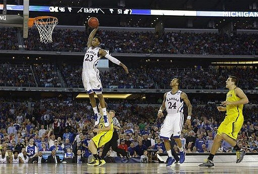 Spike Albrecht (2) and Mitch McGary (4)