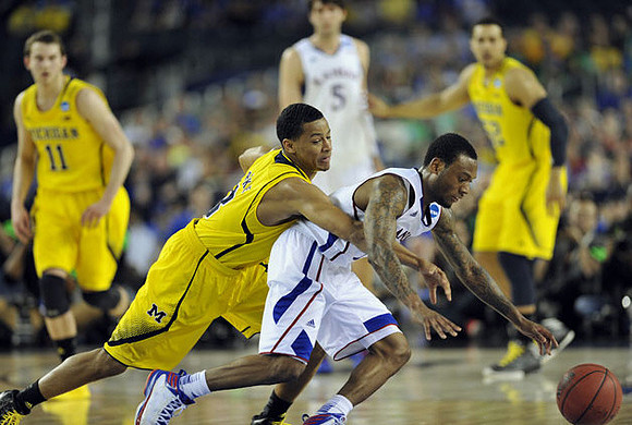 Nik Stauskas (11), Trey Burke (3), and Jordan Morgan (52)