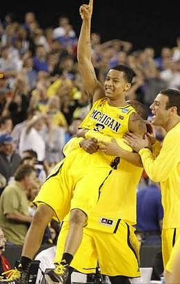 Trey Burke (3), Corey Person (32), and Josh Bartelstein (20)
