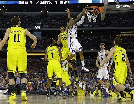 Nik Stauskas (11), Glenn Robinson III (1), Jon Horford (15), and Spike Albrecht (2)