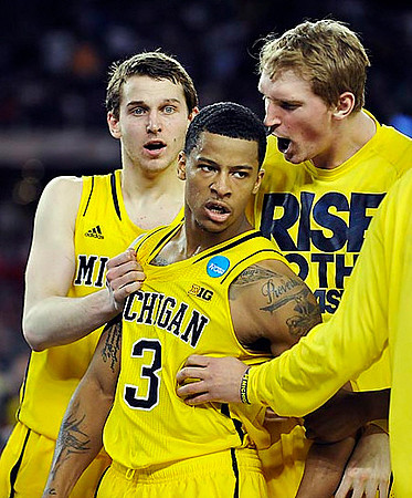 Nik Stauskas (11), Trey Burke (3), and Blake McLimans (22)