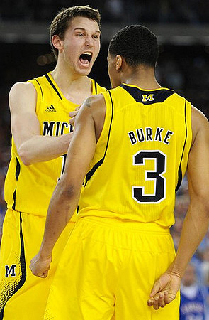 Nik Stauskas (11) and Trey Burke (3)