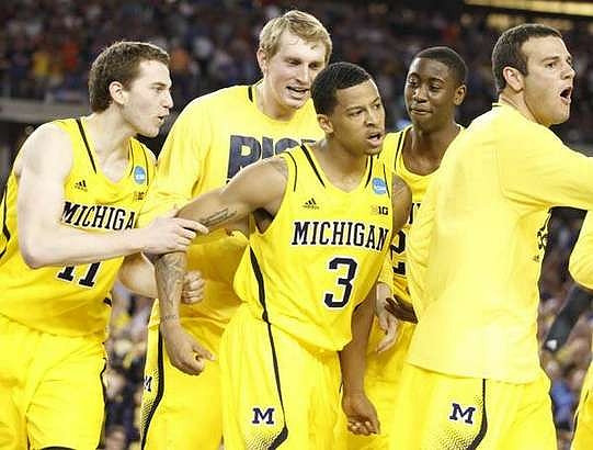 Nik Stauskas (11), Blake McLimans (22), Trey Burke (3), Caris LeVert (23), and Josh Bartelstein (20)