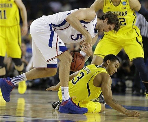 Nik Stauskas (11), Trey Burke (3), and Jordan Morgan (52)