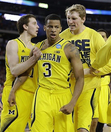 Nik Stauskas (11), Trey Burke (3), and Blake McLimans (22)