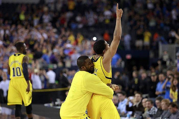 Tim Hardaway Jr. (10), Trey Burke (3), and Corey Person (32)