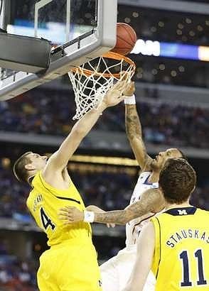 Mitch McGary (4) and Nik Stauskas (11)