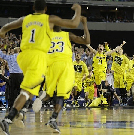 Glenn Robinson III (1), John Beilein, Caris LeVert (23), Jon Horford (15), Nik Stauskas (11), Spike Albrecht (2), and Max Bielfeldt (44)