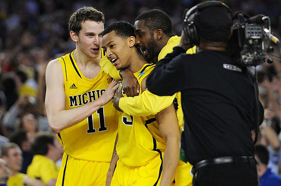 Nik Stauskas (11), Trey Burke (3), and Corey Person (32)