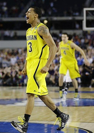 Trey Burke (3) and Mitch McGary (4)