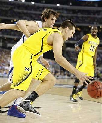Mitch McGary (4) and Tim Hardaway Jr. (10)