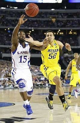 Jordan Morgan (52) and Trey Burke (3)