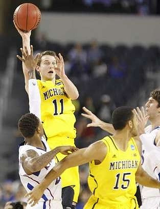 Nik Stauskas (11) and Jon Horford (15)