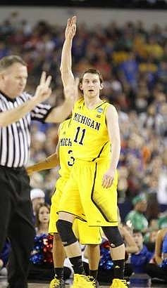 Trey Burke (3) and Nik Stauskas (11)