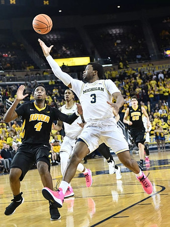 Charles Matthews (1) and Zavier Simpson (3)