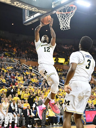 Muhammad-Ali Abdur-Rahkman (12) and Zavier Simpson (3)