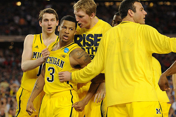 Nik Stauskas (11), Trey Burke (3), Blake McLimans (22), Caris LeVert (23), and Josh Bartelstein (20)