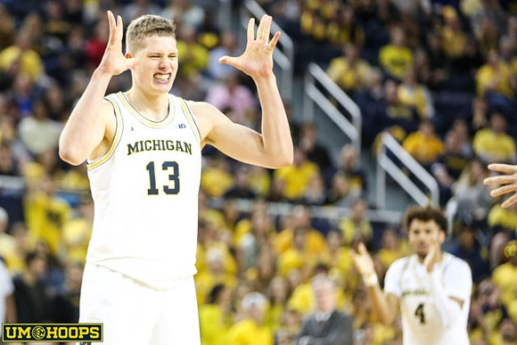 Moritz Wagner (13) and Isaiah Livers (4)