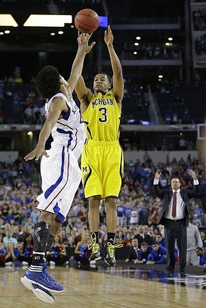 Trey Burke (3) and Kansas Head Coach Bill Self