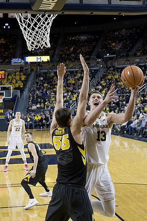 Duncan Robinson (22) and Moritz Wagner (13)