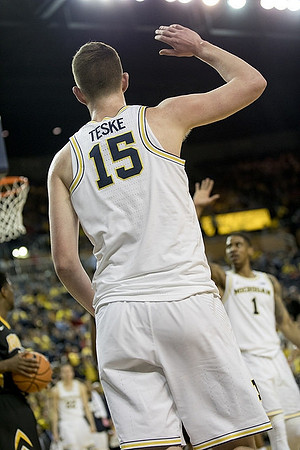 Jon Teske (15) and Charles Matthews (1)