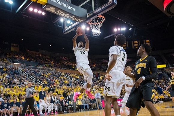 Muhammad-Ali Abdur-Rahkman (12) and Zavier Simpson (3)