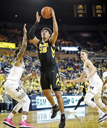 Charles Matthews (1), Moritz Wagner (13), and Zavier Simpson (3)