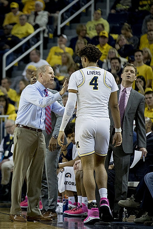 John Beilein, Isaiah Livers (4), and Luke Yaklich