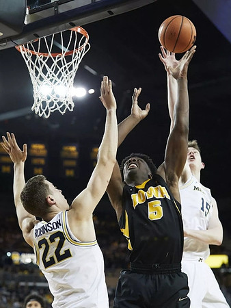 Duncan Robinson (22) and Jon Teske (15)