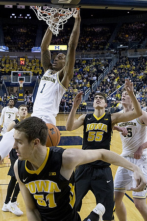Charles Matthews (1), Jon Teske (15), and Zavier Simpson (3)