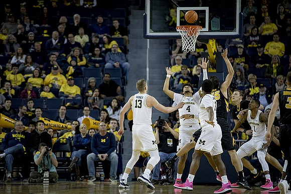 Moritz Wagner (13), Isaiah Livers (4), Zavier Simpson (3), and Charles Matthews (1)