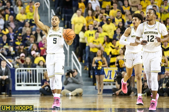 Jaaron Simmons (5), Jordan Poole (2), and Muhammad-Ali Abdur-Rahkman (12)