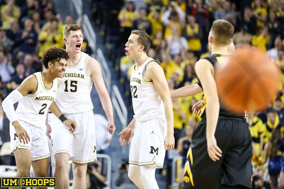 Jordan Poole (2), Jon Teske (15), and Duncan Robinson (22)