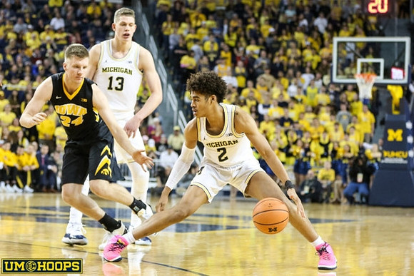 Moritz Wagner (13) and Jordan Poole (2)