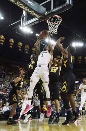 Charles Matthews (1), Duncan Robinson (22), and Muhammad-Ali Abdur-Rahkman (12)